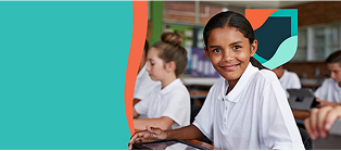 Smiling student in classroom with tablet.